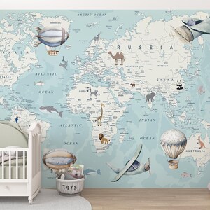 May include: A child's nursery with a world map mural in pastel blue and beige, decorated with animal illustrations, hot air balloons, and aeroplanes. A white cot and a soft toy elephant are in the foreground.