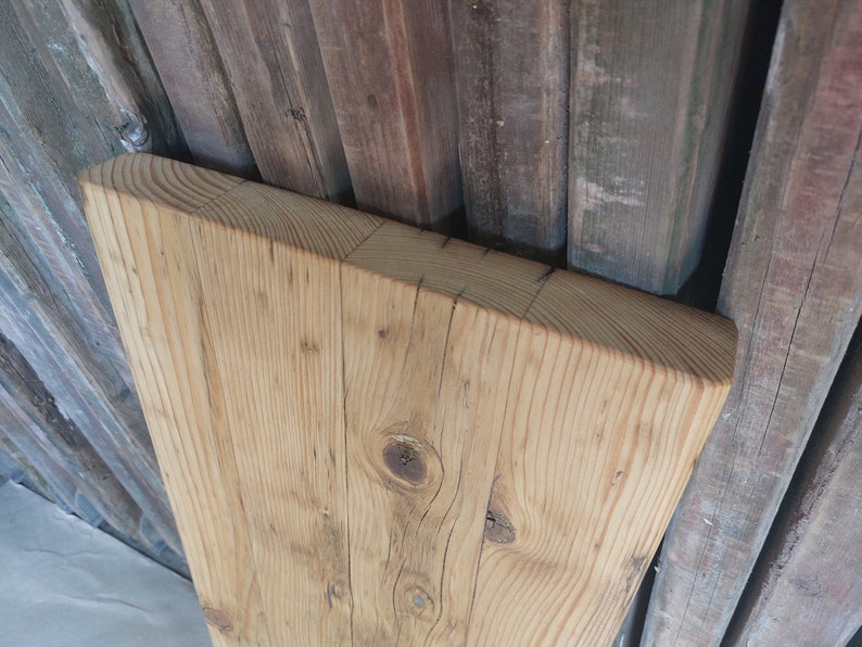 May include: A rustic wooden sign with the text "Welcome to our home" in white lettering. The sign features a distressed finish and a simple, inviting design, perfect for entryway decor.