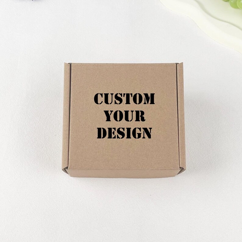 May include: A plain brown cardboard box with the text "CUSTOM YOUR DESIGN" printed in black.