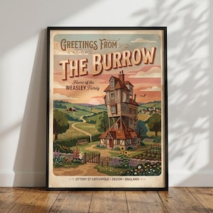 May include: A framed poster featuring a tall, multi-story house with the text Greetings From The Burrow, Home of the Weasley Family, and Ottery St Catchpole, Devon, England. The illustration depicts a rural landscape with gardens and rolling hills.