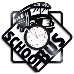 May include: Black vinyl record clock with a school bus design and the words "School Bus" around the clock face.