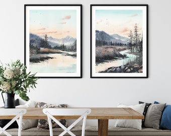 May include: Two framed watercolor paintings of a river flowing through a forest with mountains in the background. The paintings are hung on a white wall above a wooden table with white chairs.