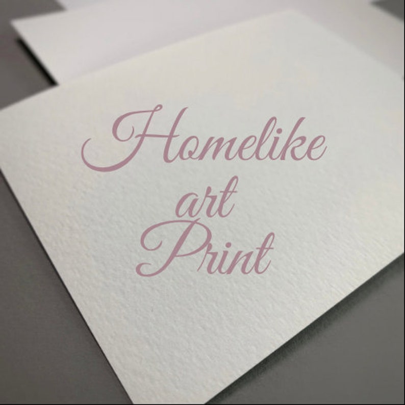 May include: A white card with the text "Homelike art Print" written in pink cursive.