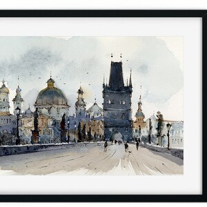 May include: A watercolor painting of a bridge in Prague, Czech Republic. The bridge is lined with buildings, including a tall tower with a pointed roof. The sky is a light blue with white clouds. People are walking across the bridge.