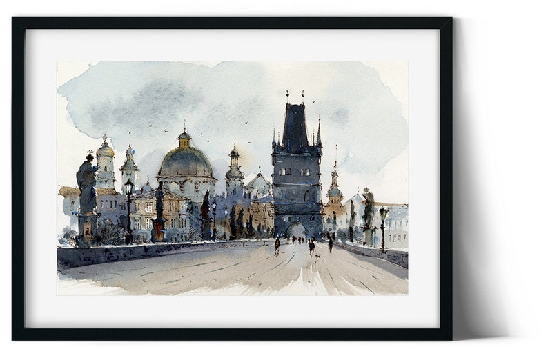 May include: A watercolor painting of a bridge in Prague, Czech Republic. The bridge is lined with buildings, including a tall tower with a pointed roof. The sky is a light blue with white clouds. People are walking across the bridge.