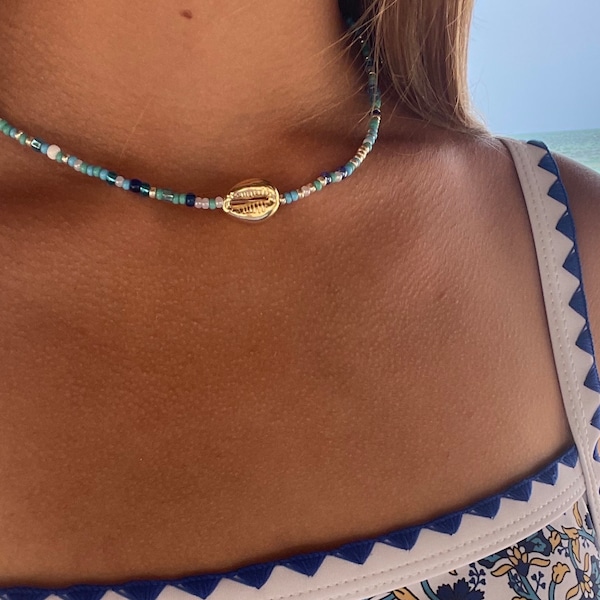 Coastal blue seed bead gold/silver puka shell necklace