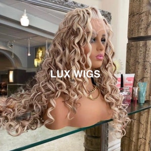 Niomi. Blonde Curly Lace Front Wig. Light blonde wig with dark blonde and copper lowlights. Blonde ringlet wig