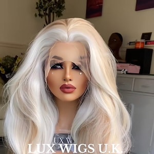 Soniah. Blonde Lace Front Wig. Ash and strawberry blonde wig with platinum highlights, long layers lace front wig. Natural 26 inch long wig