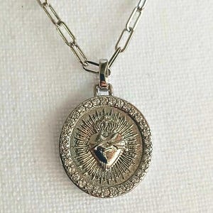 Elevate your accessory collection with this Silver Pendant Necklace Silver Chain Sacred Heart Cross Necklace. Thoughtfully designed, it makes a meaningful Faith Gifts Christian Women Jewelry for Men Necklace. A versatile and stylish Silver Charm Gifts piece, perfect for everyday wear or special occasions.