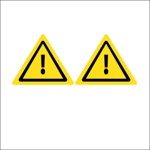May include: Two yellow warning signs with black borders and an exclamation point in the center.