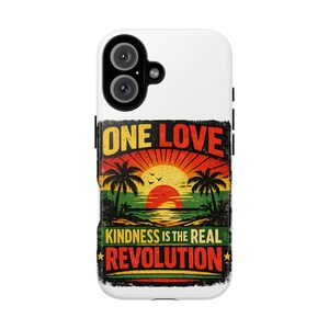 May include: White phone case with a colorful graphic. The design features a sunset over the ocean with palm trees and the words "ONE LOVE" and "KINDNESS IS THE REAL REVOLUTION" in a distressed font.