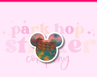 May include: A white-bordered sticker in the shape of Mickey Mouse's head. The sticker features a colorful illustration of a resort with zebras, palm trees, and lush greenery. The background is a soft pink with the words "Park Hop Sticker Company".