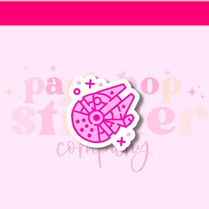 May include: Pink outline sticker of a spaceship with a white background. The sticker has a white border and a pink outline. The spaceship is a classic design with a round body and a pointed nose. The sticker is perfect for adding a touch of fun to any project.