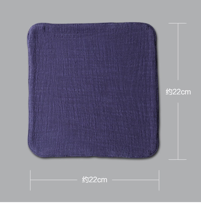 May include: A dark purple square cloth measuring approximately 22 inches by 22 inches.
