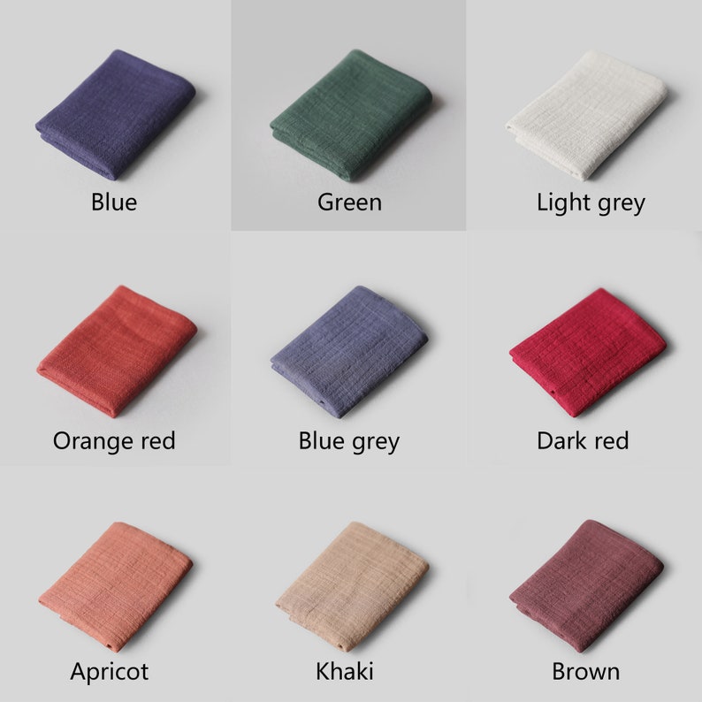 May include: Nine fabric swatches in various colors, including blue, green, light grey, orange red, blue grey, dark red, apricot, khaki, and brown. The swatches are arranged in a grid pattern on a light grey background.