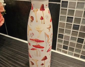 Botella de agua de metal con estampado de hongos