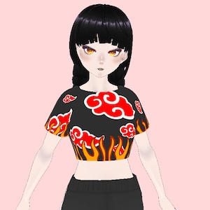 Puede incluir: Top corto negro con llamas rojas y naranjas y nubes rojas. Las nubes tienen un diseño de remolino.