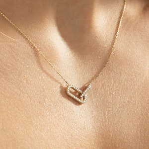 diamond necklace	intertwined necklace	eternity necklace	14k gold necklace	real gold necklace	solid gold necklace	interlocking pendant	real diamond pendant	eternal love pendant	14k gold love charm	gold necklace womens	geometric necklace	elegant