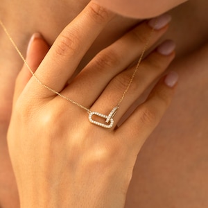 diamond necklace	intertwined necklace	eternity necklace	14k gold necklace	real gold necklace	solid gold necklace	interlocking pendant	real diamond pendant	eternal love pendant	14k gold love charm	gold necklace womens	geometric necklace	elegant