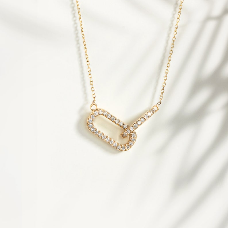 diamond necklace	intertwined necklace	eternity necklace	14k gold necklace	real gold necklace	solid gold necklace	interlocking pendant	real diamond pendant	eternal love pendant	14k gold love charm	gold necklace womens	geometric necklace	elegant