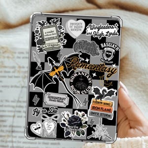 May include: Clear phone case with a black and gray checkered pattern, adorned with stickers. Stickers include a dragon, the words "Romantasy Book Club", and "Wingleaders and High Lords".