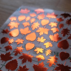 Stickers herfstbladeren in oranje koper of goud