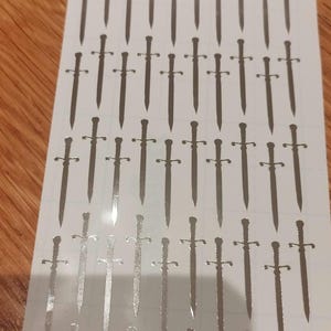 100 stickers épée en vinyle chromé