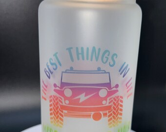 May include: A frosted glass tumbler with a bamboo lid and a clear straw. The tumbler has a rainbow-colored graphic of a jeep with the text "The Best Things in Life Mess Up Your Hair" printed on it.