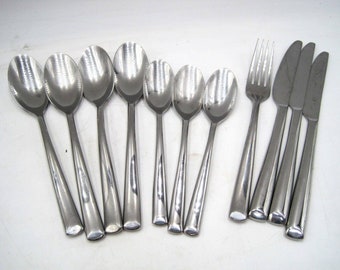 May include: A set of silverware, including spoons, forks, and knives, all made of polished stainless steel.
