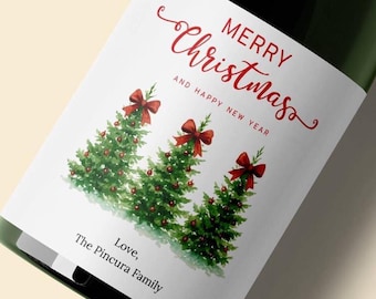 May include: A green champagne bottle with a red foil top. The label reads "Merry Christmas" with three Christmas trees and red bows. The bottom of the label says "Love, The Pincura Family."