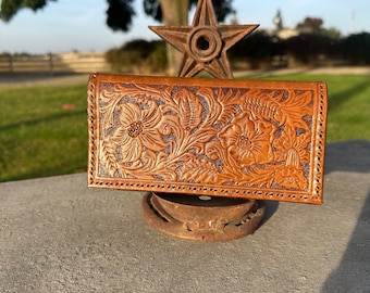 Handmade, tooled leather checkbook cover or billfold.
