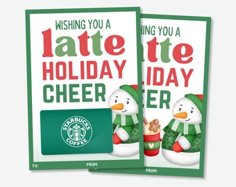 May include: A green and white gift card with a Starbucks logo and the text "Wishing you a latte holiday cheer". Two snowmen are holding a cup of coffee and a gingerbread man. The text "To:" and "From:" are at the bottom of the card.