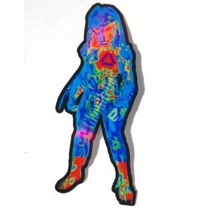 May include: A blue and red thermal image of a Predator character. The character is standing with its arms at its sides and its legs slightly bent. The character is wearing a helmet and has a weapon on its back.
