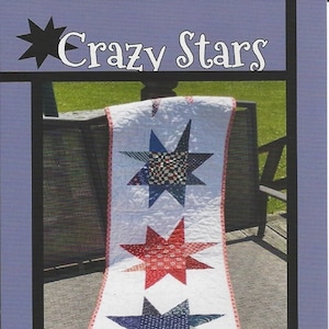 May include: A quilt pattern featuring three colorful stars with a white background. The quilt is called "Crazy Stars" and is designed by Tricia Lynn Maloney for Orphan Quilt Designs.