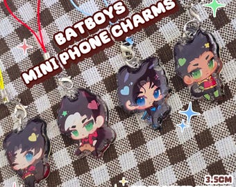 May include: Mini phone charms featuring Batboys characters. Each charm is a doublesided epoxy design with color-coded straps. The charms are approximately 3.5cm in height and feature various character designs with vibrant colors.