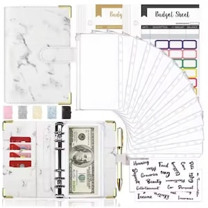 May include: A white marble-patterned budget binder with gold corner accents, a snap closure, and a ring binder mechanism. Includes budget sheets, expense labels, and a pen. Features pockets for cards and cash, with a $100 bill visible.
