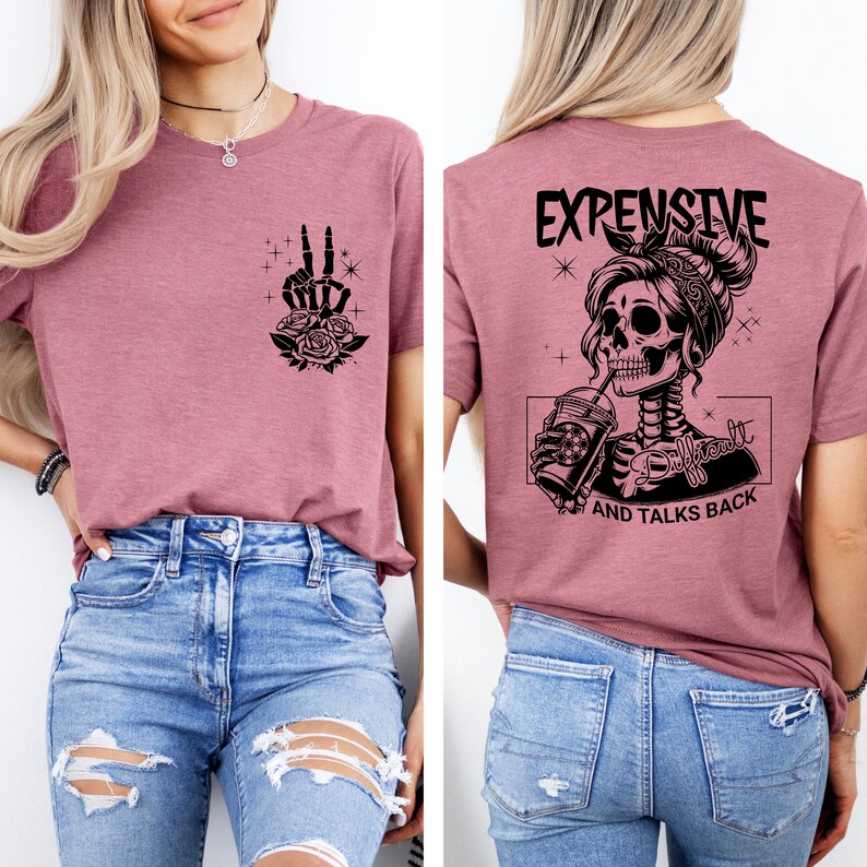 May include: A mauve t-shirt with a skeleton graphic on the back. The graphic shows a skeleton woman with a bandana, drinking from a cup. The text on the back reads "Expensive, Difficult, and Talks Back". The front of the shirt has a skeleton hand graphic with roses.