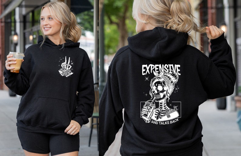 May include: Black hoodie with a white graphic of a skeleton woman drinking from a cup with the text "Expensive and Talks Back".