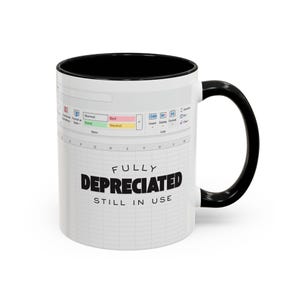 May include: White ceramic mug with a black interior and handle. The mug features a spreadsheet design with the text "FULLY DEPRECIATED STILL IN USE". The mug has a humorous theme.