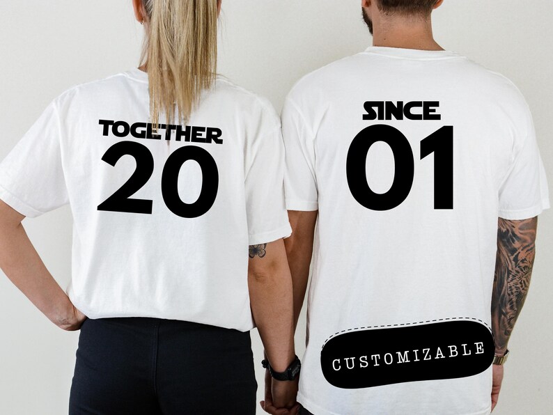 May include: Two white t-shirts with black text. One shirt says "Together 20" and the other says "Since 01" with a customizable area below the text.