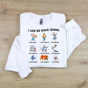 Felpa e maglietta per bambini con il personaggio di I Can Do Hard Things