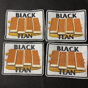 May include: Four square patches with the words "BLACK FLAN" embroidered in black on a white background. The patches feature a design of four rectangular brown shapes with a gold-colored base.