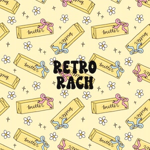 May include: A repeating pattern on a light yellow background featuring illustrations of butter sticks with pink and blue bows, white flowers, and the text "Retro Rach". The word "butter" is written on each butter stick.