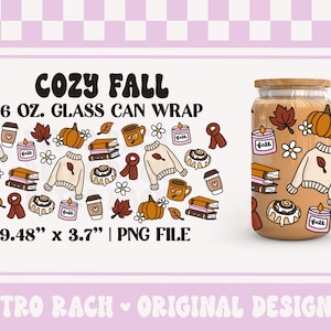 May include: A glass can wrap with a cosy autumn theme. The design includes pumpkins, sweaters, coffee cups, candles, and leaves. The text reads "COZY FALL" and "16 OZ. GLASS CAN WRAP". The wrap measures 24.08 cm x 9.40 cm.