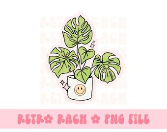 May include: A green monstera plant in a white pot with a smiley face on it. The plant has three leaves and is surrounded by pink glitter.