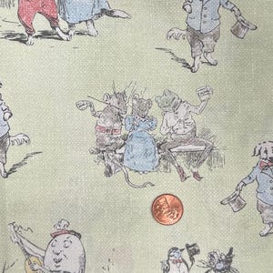 May include: Pale green fabric featuring a repeating pattern of illustrated animals in period clothing. The design includes dogs, mice, and a frog, with a penny for scale. The fabric has a dotted texture.