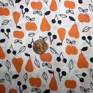 May include: White fabric with a repeating pattern of orange pears, apples, and black cherries with leaves.