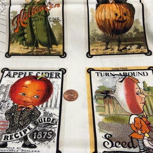 May include: White fabric featuring vintage-style illustrations of Halloween-themed seed packets. The packets depict anthropomorphic fruits and vegetables, including a pumpkin, apple, and turnip. Text includes "Halloween Greens," "Apple Cider Recipe Guide 1875," and "Turn Around Seed."