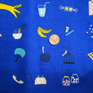 May include: Bright blue fabric featuring a repeating pattern of quirky illustrations. The design includes bananas, a glass of water, a telephone, a birdcage, and other playful elements. A penny is included for scale.