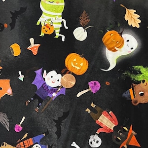 May include: A black Halloween-themed fabric with various cartoon characters and objects. The design includes pumpkins, bats, ghosts, a frog, a vampire, and other festive elements. The fabric is suitable for crafting or seasonal decor.